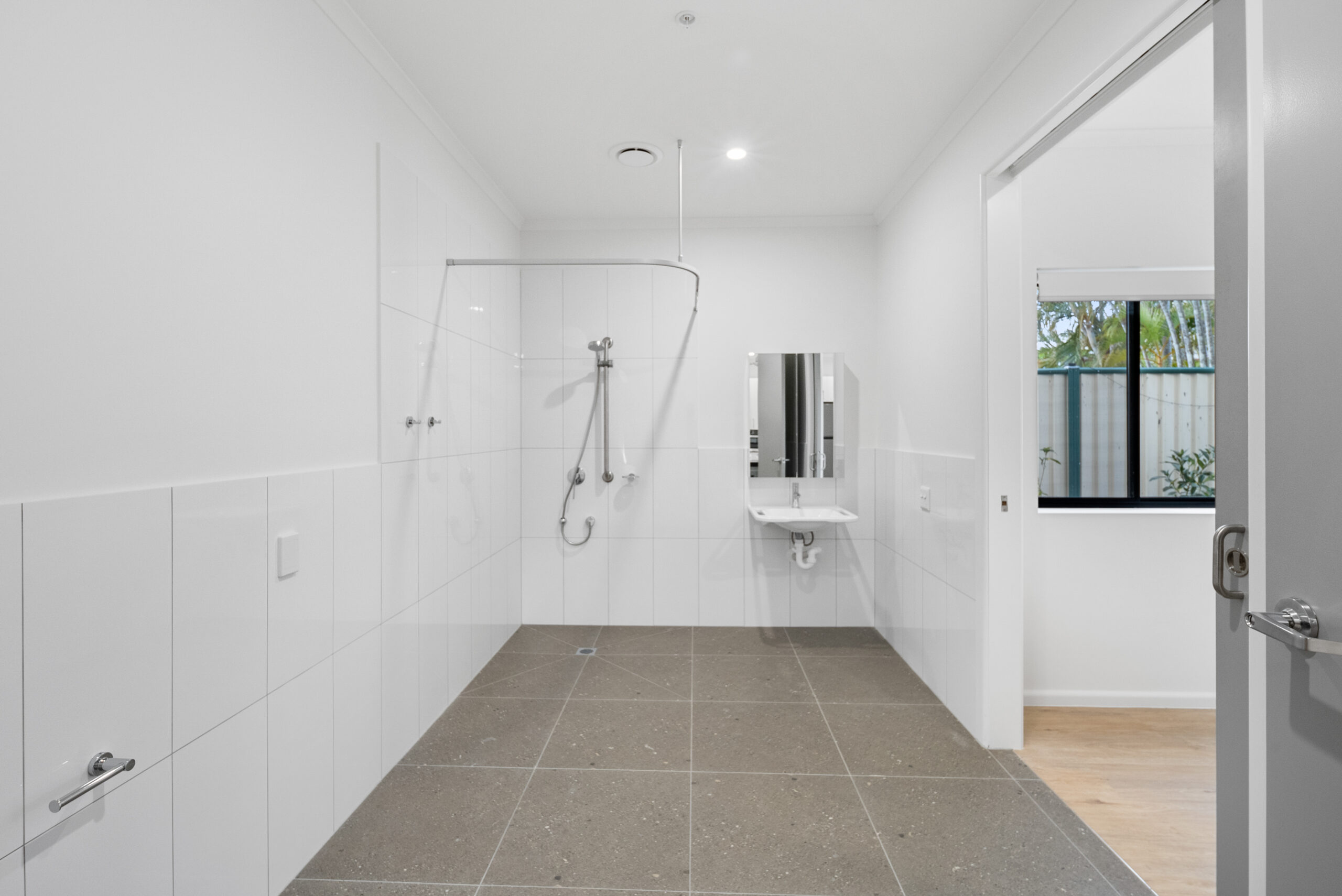 Modern High Physical Support SDA apartments in Algester, QLD – accessible design with ceiling hoists, smart home technology, and shared therapy facilities.